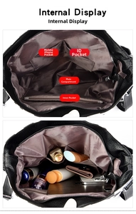 Internal view of black pebbled leather tote with multi-pocket fabric lining storage
