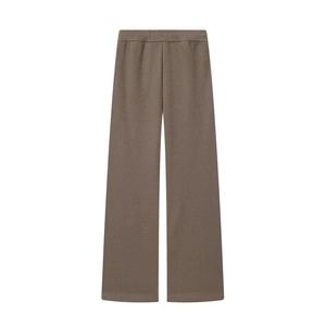 Detailed view of dark brown wide-leg sweatpants featuring an elastic waistband and soft fabric