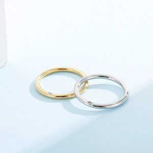 Minimalist stainless steel rings in gold and silver finish with small round diamonds