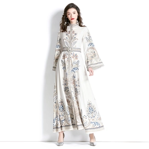 Ivory long sleeve bohemian maxi dress with paisley floral print and flared bell sleeves