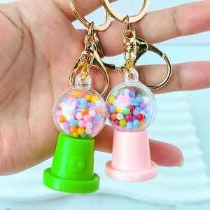 Creative macaron candy machine keychain pendant with colorful balls in pink and green