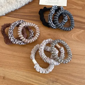 Elastic fabric and spiral cord hair tie set in black, brown, and leopard print
