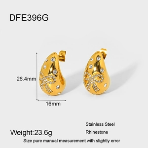 Detailed view of 18K gold plated teardrop bow earrings with sparkling rhinestone inlay