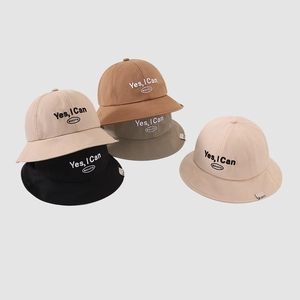 Kids cotton bucket hat with 'Yes, I Can' embroidery in beige, brown and green colors