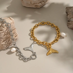 Bracelet élégant en perles avec queue de poisson, finitions or et argent pour femmes