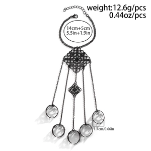 Detail of gothic black metal hand chain with dimensions and weight measurements