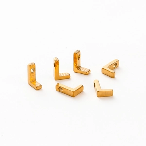 Detail of vacuum gold-plated 1.8mm alphabet charms for DIY jewelry making
