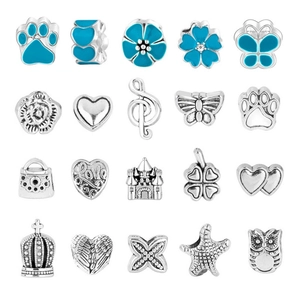 Macro display of diverse silver charms and blue enamel beads for DIY jewelry making