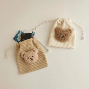Corduroy bear drawstring pouch in cream and khaki colors for organizing small accessories
