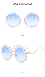 Close-up of gold round frame sunglasses with pearls and gradient blue lenses