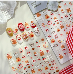 Detail of Christmas nail stickers with cute bears, reindeer and festive text patterns