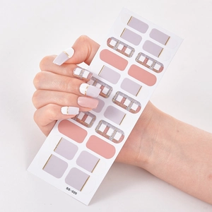 Macro shot of SS-020 pink and lavender self-adhesive nail stickers with gold lines