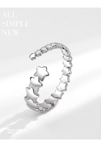 Detail of vintage silver five-point star ring with adjustable open band for women