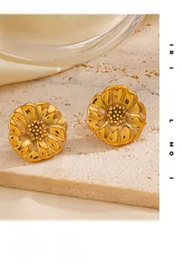 Close-up of 18K gold plated flower stud earrings with vintage texture on stone base