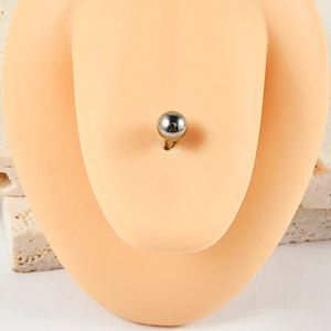 Close-up of G23 titanium ball tongue ring jewelry displayed on realistic body model