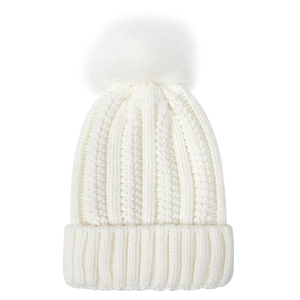 Detailed texture of white knit beanie with soft pom-pom and ribbed cuff for winter