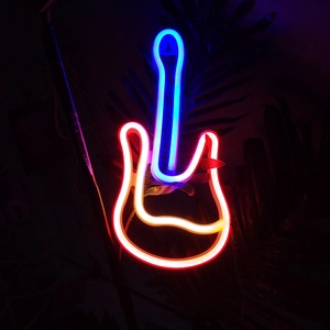 Vibrant violin-shaped LED neon sign in red, blue, and yellow on dark background