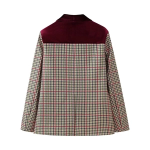 Detail of burgundy velvet patchwork on houndstooth blazer jacket for women