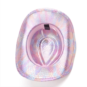 Interior detail of a pink holographic fish scale cowboy hat showing the wash label.