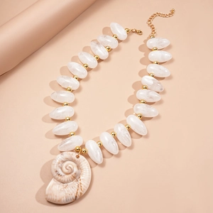 Statement acrylic beaded necklace with a brown conch shell pendant on a pink background