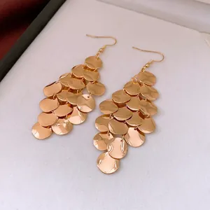 Luxury gold layered disk sequin earrings with a vintage tassel drop and hook design