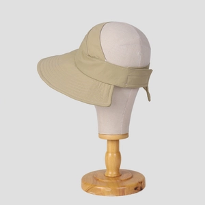 Detail of khaki visor hat with reinforced stitching and adjustable velcro closure