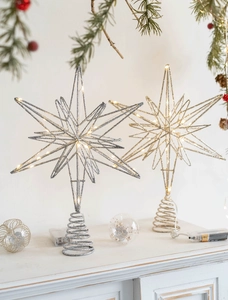 Golden and silver metal lighted tree toppers with spiral base and warm LED glowing stars