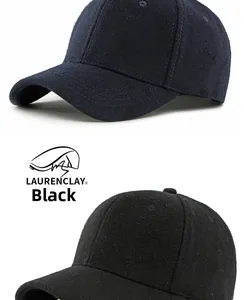 Detail of wool blend texture and reinforced stitching on navy and black baseball caps