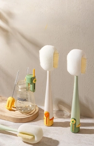 Close-up of flower-shaped multifunctional cup brush set with long handle and sponge head