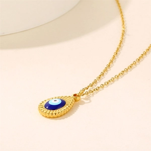 Gold stainless steel evil eye pendant necklace with blue enamel and sunburst texture