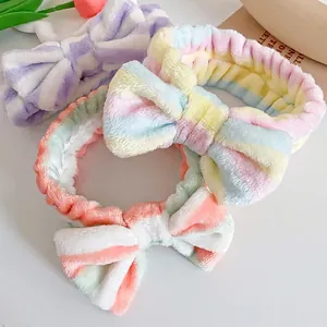 Three coral fleece bow headbands with pastel stripes for face washing and makeup use