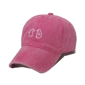Pink washed cotton baseball cap with cute penguin embroidery and minimalist style