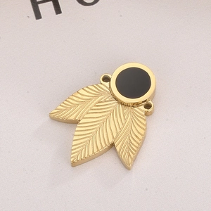 Gold stainless steel feather pendant with black circular inlay and top bail link