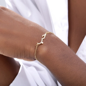 Elegant gold Arabic love charm bracelet with shimmering zircons for a minimalist look