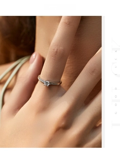 Close-up of s925 silver ring with rose gold accents and round brilliant cut zircon