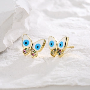 Gold butterfly stud earrings with white enamel, colorful zircon and blue evil eye detail