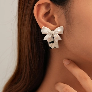 Elegant black and white resin bow earrings with marble texture rectangle pendant