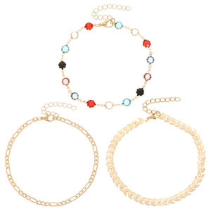 Three-piece gold anklet set featuring colorful evil eye crystals and leaf chain links