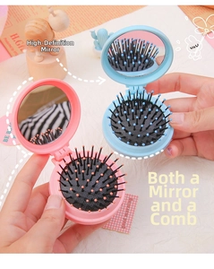 Compact folding hairbrush with integrated mirror and massage bristles in pastel colors