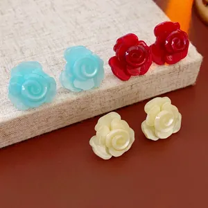 Elegant 3D resin rose stud earrings in blue, red, and yellow with pearl finish
