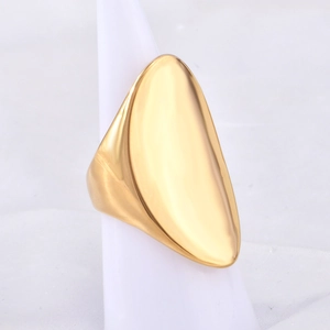 Minimalist gold-plated curved stainless steel ring on a white display stand