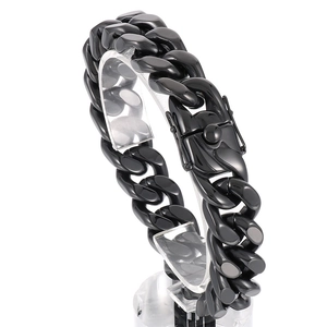 Grosse gourmette noire pour homme en acier inoxydable avec fermoir dragon sur fond blanc