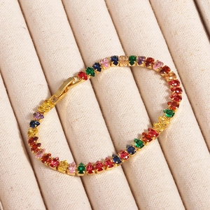 Detail of multi-color gemstone tennis bracelet with 18K gold-plated fold-over clasp
