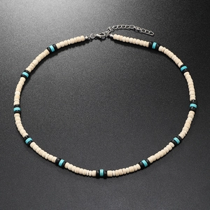 Close-up of vintage men's coconut shell and turquoise beaded necklace with lobster clasp