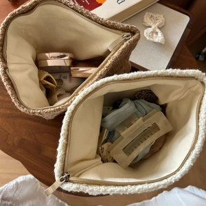 Detail showing plush fleece and woven texture makeup bag set with items inside