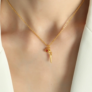18k gold plated stainless steel necklace featuring a red tulip rhinestone pendant on a model