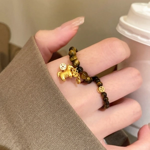 Tiger eye beaded ring with golden horse and coin charms for luck and style