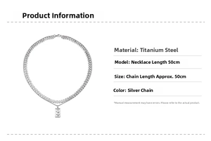 Detail view of silver titanium steel Cuban chain necklace with vintage coin pendant