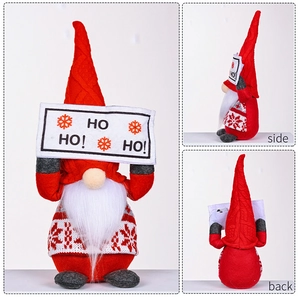 Three-sided view of a Christmas gnome decoration with HO HO! sign and snowflake embroidery