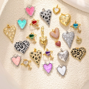 Golden and silver heart pendants with leopard print, enamel and zircon details